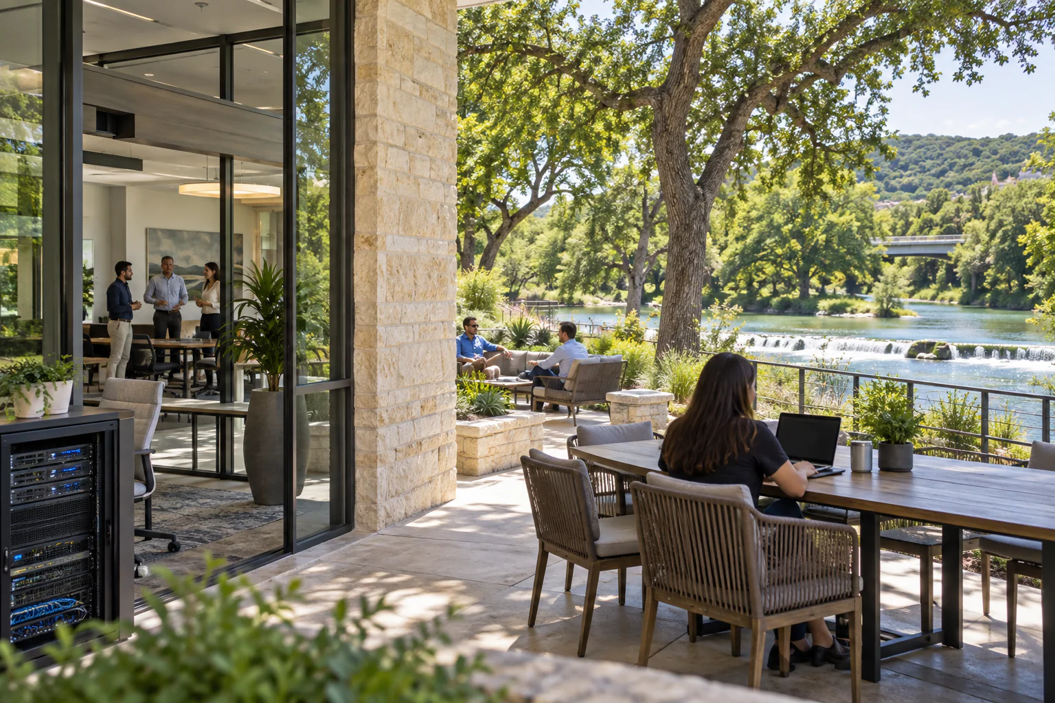Connected New Braunfels office overlooking a shaded Hill Country waterway